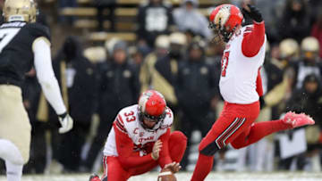 BOULDER, CO - NOVEMBER 17: Mitch Wishnowsky #33 holds as Matt Gay #97 of the Utah Utes kicks a field goal against the Colorado Buffaloes in the fourth quarter at Folsom Field on November 17, 2018 in Boulder, Colorado. (Photo by Matthew Stockman/Getty Images)
