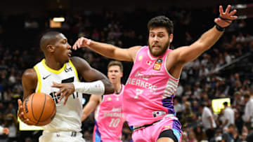 SALT LAKE CITY, UTAH - OCTOBER 16: Kris Dunn #11 of the Utah Jazz drives into Will McDowell-White #7 of the New Zealand Breakers during the first half of a preseason game at Delta Center on October 16, 2023 in Salt Lake City, Utah. NOTE TO USER: User expressly acknowledges and agrees that, by downloading and or using this photograph, User is consenting to the terms and conditions of the Getty Images License Agreement. (Photo by Alex Goodlett/Getty Images)