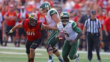 Sep 19, 2015; College Park, MD, USA; South Florida Bulls quarterback Quinton Flowers (9) is pressured by Maryland Terrapins lineman Roman Braglio (90) at Byrd Stadium. Mandatory Credit: Mitch Stringer-USA TODAY Sports