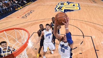 DENVER, CO - NOVEMBER 11: Aaron Gordon #00 of the Orlando Magic dunks against the Denver Nuggets on November 11, 2017 at the Pepsi Center in Denver, Colorado. NOTE TO USER: User expressly acknowledges and agrees that, by downloading and/or using this Photograph, user is consenting to the terms and conditions of the Getty Images License Agreement. Mandatory Copyright Notice: Copyright 2017 NBAE (Photo by Garrett Ellwood/NBAE via Getty Images)