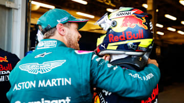 Sebastian Vettel, Aston Martin, and Sergio Perez, Red Bull, Formula 1 (Photo by Maxim Shemetov - Pool/Getty Images)