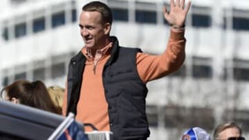 Feb 9, 2016; Denver, CO, USA; Denver Broncos quarterback Peyton Manning waves to the crowd during the Super Bowl 50 championship parade at Civic Center Park. Mandatory Credit: Ron Chenoy-USA TODAY Sports