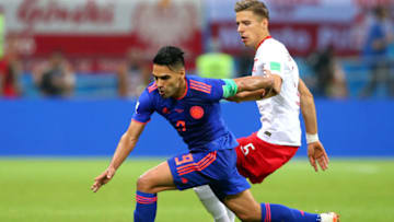 KAZAN, RUSSIA - JUNE 24: Radamel Falcao of Colombia is challenged by Jan Bednarek of Poland during the 2018 FIFA World Cup Russia group H match between Poland and Colombia at Kazan Arena on June 24, 2018 in Kazan, Russia. (Photo by Alex Livesey/Getty Images)