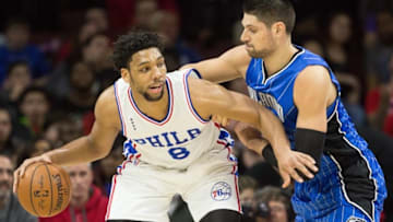 Feb 23, 2016; Philadelphia, PA, USA; Philadelphia 76ers center Jahlil Okafor (8) dribbles against Orlando Magic center Nikola Vucevic (9) during the first quarter at Wells Fargo Center. Mandatory Credit: Bill Streicher-USA TODAY Sports