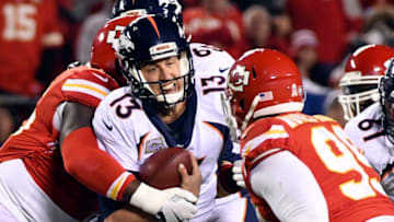 KANSAS CITY, MO - OCTOBER 30: Denver Broncos quarterback Trevor Siemian (13) gets sacked by Kansas City Chiefs nose tackle Bennie Logan (96) during the third quarter on October 30, 2017 in Kansas City, MO at Arrowhead Stadium. (Photo by John Leyba/The Denver Post via Getty Images)