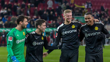 AUGSBURG, GERMANY - JANUARY 18: (BILD ZEITUNG OUT) goalkeeper Roman Buerki of Borussia Dortmund, Giovanni Reyna of Borussia Dortmund, Erling Braut Haaland of Borussia Dortmund and Manuel Akanji of Borussia Dortmund laughs during the Bundesliga match between FC Augsburg and Borussia Dortmund at WWK-Arena on January 18, 2020 in Augsburg, Germany. (Photo by TF-Images/Getty Images)