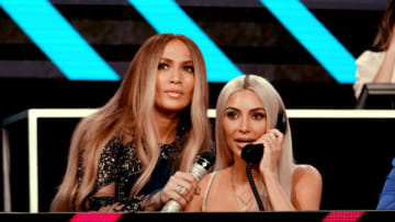 LOS ANGELES, CA - OCTOBER 14: In this handout photo provided by One Voice: Somos Live!, Jennifer Lopez (L) and Kim Kardashian participate in the phone bank onstage during "One Voice: Somos Live! A Concert For Disaster Relief" at the Universal Studios Lot on October 14, 2017 in Los Angeles, California. (Photo by Kevin Mazur/One Voice: Somos Live!/Getty Images)