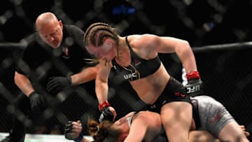LAS VEGAS, NV - OCTOBER 06: Aspen Ladd (top) beats Tonya Evinger (bottom) to a TKO in their women's bantamweight bout during the UFC 229 event inside T-Mobile Arena on October 6, 2018 in Las Vegas, Nevada. (Photo by Harry How/Getty Images)