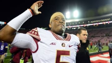 Oct 30, 2014; Louisville, KY, USA; Florida State Seminoles quarterback Jameis Winston (5) walks off the field after defeating the Louisville Cardinals 42-31 at Papa John