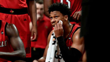 NEW YORK, NEW YORK - NOVEMBER 23: Dwayne Sutton #24 of the Louisville Cardinals listens in the huddle during the first half of the game against Marquette Golden Eagles at the NIT Season Tip-Off Tournament at Barclays Center on November 23, 2018 in the Brooklyn borough of New York City. (Photo by Sarah Stier/Getty Images)