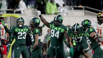 Michigan State Spartans defensive end Alex Okelo (93) signals fourth down after a stop against the Maryland Terrapins during second half action Saturday, Nov. 13, 2021 at Spartan Stadium.Msu defense happy