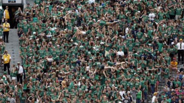 Sep 26, 2015; South Bend, IN, USA; Notre Dame Fighting Irish fans do push ups after scoring a touchdown against the University of Massachusetts at Notre Dame Stadium. Notre Dame defeats Massachusetts 62-27. Mandatory Credit: Brian Spurlock-USA TODAY Sports