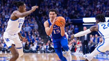 LEXINGTON, KY - JANUARY 28: Kevin McCullar Jr. #15 of the Kansas Jayhawks dribbles against Antonio Reeves #12 of the Kentucky Wildcats at Rupp Arena on January 28, 2023 in Lexington, Kentucky. (Photo by Michael Hickey/Getty Images)