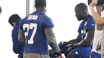 Jun 12, 2014; East Rutherford, NJ, USA; New York Giants outside linebacker Jon Beason (52) is tended to on the sidelines during New York Giants minicamp at the Quest Diagnostics Training Center. William Perlman/The Star-Ledger-USA TODAY Sports