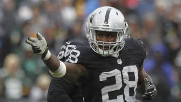 Dec 20, 2015; Oakland, CA, USA; Oakland Raiders running back Latavius Murray (28) reacts after picking up a first down against the Green Bay Packers in the second quarter at O.co Coliseum. Mandatory Credit: Cary Edmondson-USA TODAY Sports