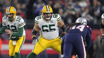Nov 4, 2018; Foxborough, MA, USA; Green Bay Packers guard Lane Taylor (65) blocks New England Patriots defensive end Adrian Clayborn (94) during the first quarter at Gillette Stadium. Mandatory Credit: Stew Milne-USA TODAY Sports
