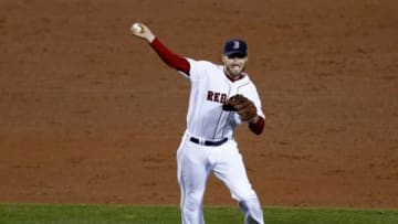 Oct 30, 2013; Boston, MA, USA; Boston Red Sox shortstop Stephen Drew (7) throws to first base against the St. Louis Cardinals during the fifth inning of game six of the MLB baseball World Series at Fenway Park. Mandatory Credit: Mark L. Baer-USA TODAY Sports