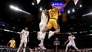 LOS ANGELES, CALIFORNIA - JANUARY 17: Talen Horton-Tucker #5 of the Los Angeles Lakers drives to the basket against Royce O'Neale #23 of the Utah Jazz during the third quarter at Crypto.com Arena on January 17, 2022 in Los Angeles, California. NOTE TO USER: User expressly acknowledges and agrees that, by downloading and/or using this photograph, User is consenting to the terms and conditions of the Getty Images License Agreement. (Photo by Katelyn Mulcahy/Getty Images)