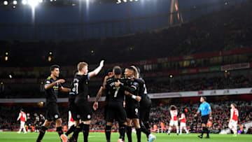 LONDON, ENGLAND - DECEMBER 15: Kevin De Bruyne of Manchester City celebrates with teammates after scoring his team's first goal during the Premier League match between Arsenal FC and Manchester City at Emirates Stadium on December 15, 2019 in London, United Kingdom. (Photo by Shaun Botterill/Getty Images)