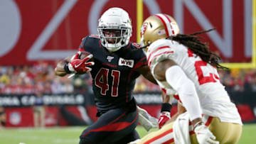 GLENDALE, ARIZONA - OCTOBER 31: Running back Kenyan Drake #41 of the Arizona Cardinals runs with the ball as Richard Sherman #25 of the San Francisco 49ers closes in for the tackle during the first half of the NFL football game at State Farm Stadium on October 31, 2019 in Glendale, Arizona. (Photo by Ralph Freso/Getty Images)