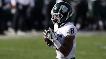 Dec 12, 2020; University Park, Pennsylvania, USA; Michigan State Spartans wide receiver Jalen Nailor (8) makes a catch and runs the ball in the end zone for a touchdown during the second quarter against the Penn State Nittany Lions at Beaver Stadium. Mandatory Credit: Matthew OHaren-USA TODAY Sports