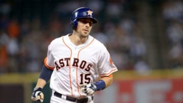 Aug 2, 2014; Houston, TX, USA; Houston Astros catcher Jason Castro (15) hits a home run against the Toronto Blue Jays during the game at Minute Maid Park. The Astros defeated the Blue Jays 8-2. Mandatory Credit: Jerome Miron-USA TODAY Sports