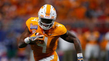 ATLANTA, GA - SEPTEMBER 04: John Kelly #4 of the Tennessee Volunteers rushes against the Georgia Tech Yellow Jackets at Mercedes-Benz Stadium on September 4, 2017 in Atlanta, Georgia. (Photo by Kevin C. Cox/Getty Images)