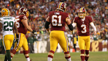 LANDOVER, MD - JANUARY 10: Kicker Dustin Hopkins #3 of the Washington Redskins celebrates with teammate guard Spencer Long #61 after kicking a first quarter field goal against the Green Bay Packers during the NFC Wild Card Playoff game at FedExField on January 10, 2016 in Landover, Maryland. (Photo by Patrick Smith/Getty Images)