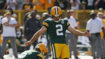 GREEN BAY, WI - SEPTEMBER 16: Mason Crosby #2 of the Green Bay Packers attempts a field goal out of the hold of JK Scott #6 against the Minnesota Vikings at Lambeau Field on September 16, 2018 in Green Bay, Wisconsin. The Vikings and the Packers tied 29-29 after overtime. (Photo by Jonathan Daniel/Getty Images)