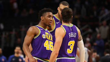 DETROIT, MICHIGAN - JANUARY 05: Donovan Mitchell #45 of the Utah Jazz celebrates late in the game with Ricky Rubio #3 while playing the Detroit Pistons at Little Caesars Arena on January 05, 2019 in Detroit, Michigan. Utah won the game 110-105. NOTE TO USER: User expressly acknowledges and agrees that, by downloading and or using this photograph, User is consenting to the terms and conditions of the Getty Images License Agreement. (Photo by Gregory Shamus/Getty Images)
