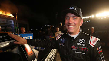 FORT WORTH, TEXAS - JUNE 07: Greg Biffle, driver of the #51 Toyota Toyota, celebrates in Victory Lane by putting the Winner's Sticker on his car after winning the NASCAR Gander Outdoors Truck Series SpeedyCash.com 400 at Texas Motor Speedway on June 07, 2019 in Fort Worth, Texas. (Photo by Chris Graythen/Getty Images)