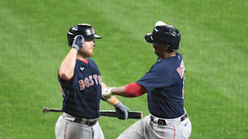BALTIMORE, MD - APRIL 10: Rafael Devers #11 of the Boston Red Sox celebrates a solo home run in the fifth inning with Christian Arroyo #39 during a baseball game against the Boston Red Sox at Oriole Park at Camden Yards on April 10, 2021 in Baltimore Maryland. (Photo by Mitchell Layton/Getty Images)