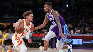 LOS ANGELES, CALIFORNIA - JANUARY 07: Trae Young #11 of the Atlanta Hawks handles the ball defended by Malik Monk #11 of the Los Angeles Lakers at Crypto.com Arena on January 07, 2022 in Los Angeles, California. NOTE TO USER: User expressly acknowledges and agrees that, by downloading and or using this photograph, User is consenting to the terms and conditions of the Getty Images License Agreement. (Photo by Meg Oliphant/Getty Images)