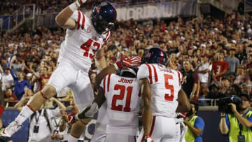 Sep 5, 2016; Orlando, FL, USA; Mississippi Rebels running back Akeem Judd (21) is congratulated after running for a touchdown against the Florida State Seminoles during the first half at Camping World Stadium. Mandatory Credit: Kim Klement-USA TODAY Sports