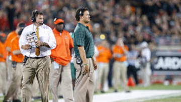 LOUISVILLE, KY - SEPTEMBER 1: Miami Hurricanes head coach Al Golden and receivers coach and recruiting coordinator Brennan Carroll look on during the game against the Louisville Cardinals at Papa John's Cardinal Stadium on September 1, 2014 in Louisville, Kentucky. (Photo by Joe Robbins/Getty Images)