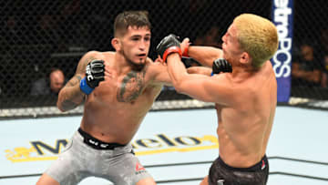CHICAGO, ILLINOIS - JUNE 09: (L-R) Sergio Pettis punches Joseph Benavidez in their flyweight fight during the UFC 225 event at the United Center on June 9, 2018 in Chicago, Illinois. (Photo by Josh Hedges/Zuffa LLC/Zuffa LLC via Getty Images)