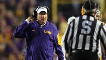 Nov 14, 2015; Baton Rouge, LA, USA; LSU Tigers head coach Les Miles talks to a referee in the first half at Tiger Stadium. Arkansas Razorbacks defeated LSU 31-14. Mandatory Credit: Crystal LoGiudice-USA TODAY Sports