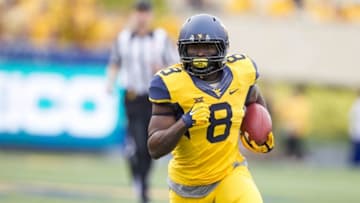 Sep 26, 2015; Morgantown, WV, USA; West Virginia Mountaineers running back Donte Thomas-Williams makes a catch against the Maryland Terrapins during the second quarter at Milan Puskar Stadium. Mandatory Credit: Ben Queen-USA TODAY Sports