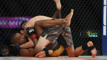 Mar 5, 2022; Las Vegas, Nevada, UNITED STATES; Edson Barboza (red gloves) fights Bryce Mitchell (blue gloves) during UFC 272 at T-Mobile Arena. Mandatory Credit: Stephen R. Sylvanie-USA TODAY Sports