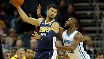 CHARLOTTE, NC - OCTOBER 25: Jamal Murray #27 of the Denver Nuggets tries to keep the ball from Kemba Walker #15 of the Charlotte Hornets during their game at Spectrum Center on October 25, 2017 in Charlotte, North Carolina. NOTE TO USER: User expressly acknowledges and agrees that, by downloading and or using this photograph, User is consenting to the terms and conditions of the Getty Images License Agreement. (Photo by Streeter Lecka/Getty Images)