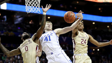 CHARLOTTE, NORTH CAROLINA - MARCH 16: Teammates Phil Cofer #0 and Devin Vassell #24 of the Florida State Seminoles defend Jack White #41 of the Duke Blue Devils during the championship game of the 2019 Men's ACC Basketball Tournament at Spectrum Center on March 16, 2019 in Charlotte, North Carolina. (Photo by Streeter Lecka/Getty Images)