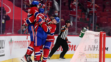 Jun 18, 2021; Montreal, Quebec, CAN; Montreal Canadiens forward Josh Anderson (17) reacts with teammates forward Paul Byron (41) and forward Jesperi Kotkaniemi (15) after scoring the winning goal during the overtime period in game three of the 2021 Stanley Cup Semifinals against the Vegas Golden Knights at the Bell Centre. Mandatory Credit: Eric Bolte-USA TODAY Sports