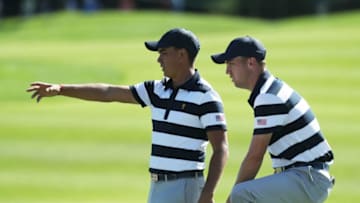 JERSEY CITY, NJ - SEPTEMBER 28: Rickie Fowler and Justin Thomas of the U.S. Team talk on the eighth green as they play against Hideki Matsuyama of Japan and the International Team and Charl Schwartzel of South Africa and the International Team during Thursday foursome matches of the Presidents Cup at Liberty National Golf Club on September 28, 2017 in Jersey City, New Jersey. (Photo by Rob Carr/Getty Images)