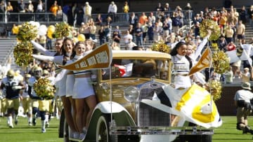 Oct 17, 2015; Atlanta, GA, USA; Georgia Tech Yellow Jackets cheerleaders ride the Ramblin Wreck car before a game against the Pittsburgh Panthers at Bobby Dodd Stadium. Mandatory Credit: Brett Davis-USA TODAY Sports