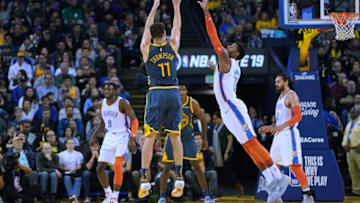 OAKLAND, CA - NOVEMBER 21: Klay Thompson #11 of the Golden State Warriors shoots over Paul George #13 of the Oklahoma City Thunder during an NBA basketball game at ORACLE Arena on November 21, 2018 in Oakland, California. NOTE TO USER: User expressly acknowledges and agrees that, by downloading and or using this photograph, User is consenting to the terms and conditions of the Getty Images License Agreement. (Photo by Thearon W. Henderson/Getty Images)