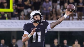 Sep 3, 2021; Orlando, Florida, USA; UCF Knights quarterback Dillon Gabriel (11) passes the ball against the Boise State Broncos during the second half at Bounce House. Mandatory Credit: Mike Watters-USA TODAY Sports