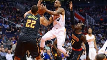 Jan 23, 2016; Phoenix, AZ, USA; Phoenix Suns guard Lorenzo Brown (41) drives the ball against Atlanta Hawks center Walter Tavares (22) and guard Dennis Schroder (17) in the first half at Talking Stick Resort Arena. Mandatory Credit: Jennifer Stewart-USA TODAY Sports