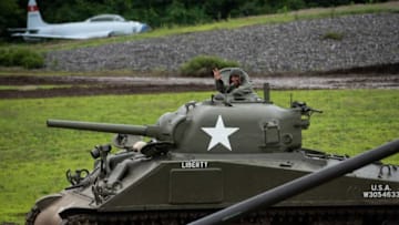HUDSON - Spectators look on during the Tank Demonstration Weekend at the American Heritage Museum on Saturday, July 10, 2021.Loc Tanks 2