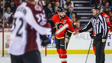 Jan 4, 2017; Calgary, Alberta, CAN; Calgary Flames defenseman Mark Giordano (5) is separated by linesman Mark Shewchyk (92) from Colorado Avalanche right wing Jarome Iginla (not pictured) during the third period at Scotiabank Saddledome. The Flames won 4-1. Mandatory Credit: Sergei Belski-USA TODAY Sports