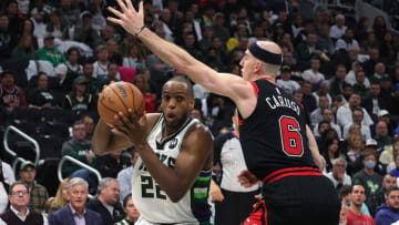MILWAUKEE, WISCONSIN - APRIL 20: Khris Middleton #22 of the Milwaukee Bucks is defended by Alex Caruso #6 of the Chicago Bulls in the second half of Game Two of the Eastern Conference First Round Playoffs at Fiserv Forum on April 20, 2022 in Milwaukee, Wisconsin. NOTE TO USER: User expressly acknowledges and agrees that, by downloading and or using this photograph, User is consenting to the terms and conditions of the Getty Images License Agreement. (Photo by Stacy Revere/Getty Images)